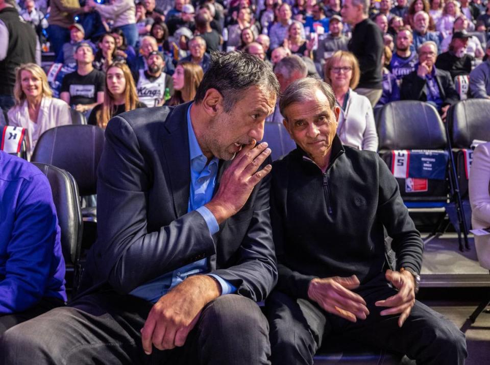 Former Sacramento Kings player and general manager Vlade Divac talks with team owner Vivek Ranadive during the game against the Warriors on Nov. 28.