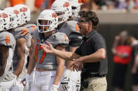 Oklahoma State head coach Mike Gundy gestures during a timeout in the second half of an NCAA college football game against Tulsa, Saturday, Sept. 11, 2021, in Stillwater, Okla. (AP Photo/Sue Ogrocki)