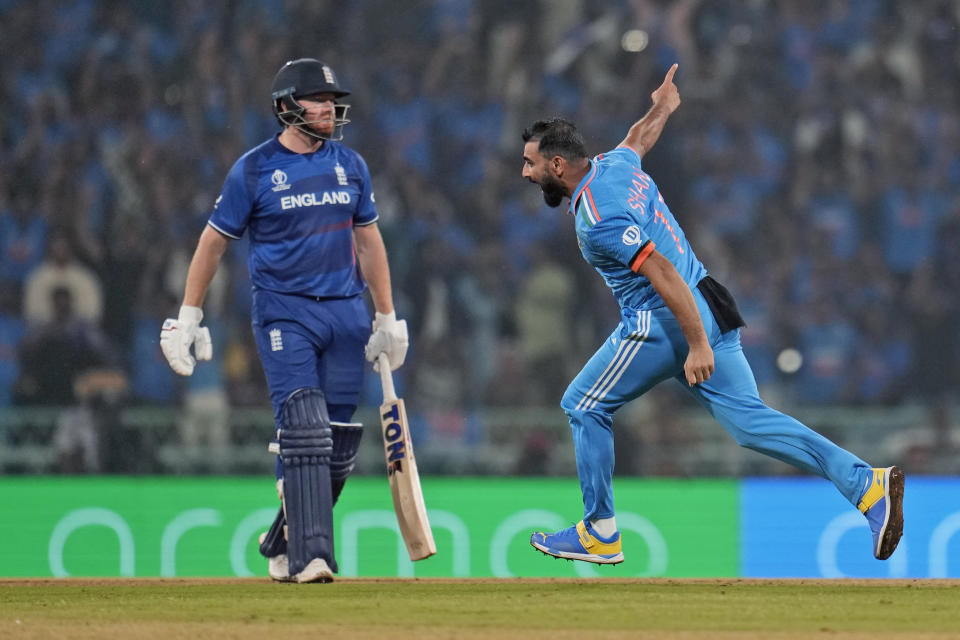 India's Mohammed Shami celebrates the wicket of England's Jonny Bairstow, left, during the ICC Men's Cricket World Cup match between England and India in Lucknow, India, Sunday, Oct. 29, 2023. (AP Photo/Aijaz Rahi)