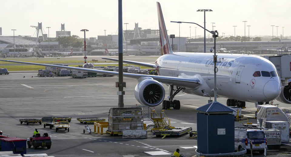 A Qantas plane waits at Sydney Airport.