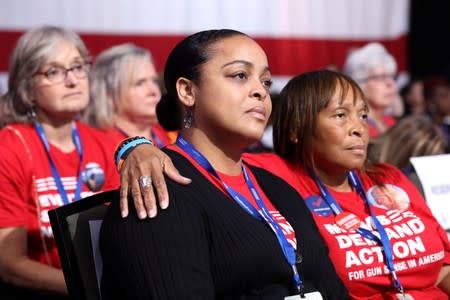 Victims of gun violence LaShea Cretain of San Diego and Roberta Gory McKelvin of Columbia, listen to 2020 Democratic U.S. presidential candidates during the Presidential Gun Sense Forum in Des Moines