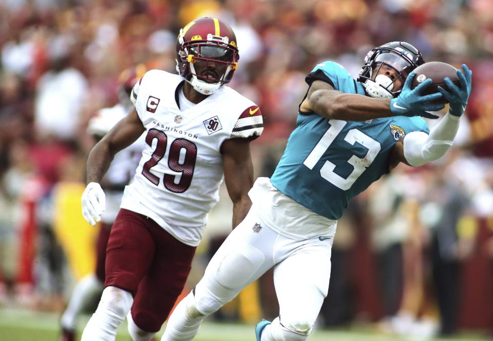 Jacksonville Jaguars wide receiver Christian Kirk (13) makes a catch during an NFL football game against the Washington Commanders, Sunday, Sept. 11, 2022 in Landover. (AP Photo/Daniel Kucin Jr.)