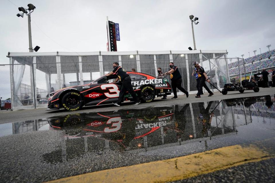 The car driven by Austin Dillon is pushed to the inspection area before the NASCAR Daytona 500 auto race at Daytona International Speedway, Sunday, Feb. 14, 2021, in Daytona Beach, Fla. (AP Photo/John Raoux) John Raoux/AP