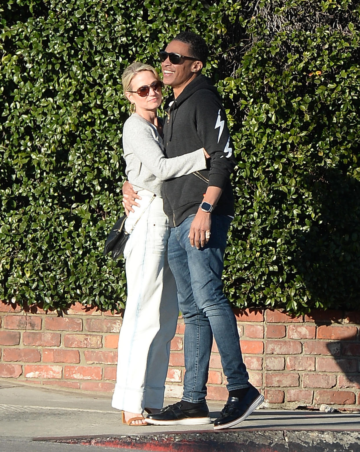 TJ Holmes and Amy Robach were spotted kissing and embracing on Friday, Jan. 27 hours after their exit from ABC News was officially announced. (Photo: TheImageDirect.com)