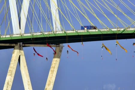 Greenpeace USA climbers form a blockade on the Fred Hartman Bridge near Baytown, Texas