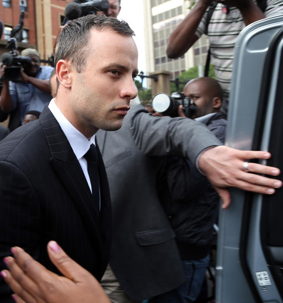 Oscar Pistorius leaves the high court in Pretoria, South Africa, Wednesday, April 9, 2014. Pistorius is charged with murder for the shooting death of his girlfriend, Reeva Steenkamp, on Valentines Day in 2013. (AP Photo/Themba Hadebe)