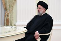 Iranian President Ebrahim Raisi speaks to Russian President Vladimir Putin during their meeting in the Kremlin in Moscow, Russia, Wednesday, Jan. 19, 2022. (Pavel Bednyakov, Sputnik, Kremlin Pool Photo via AP)