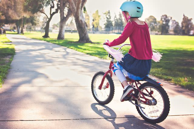 <p>Getty</p> A stock image of a kid riding a bike