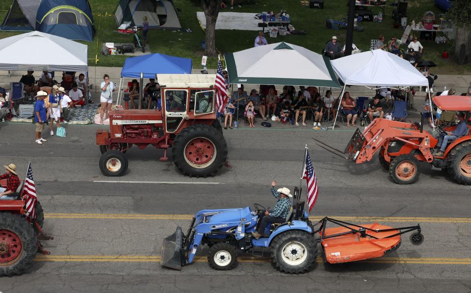 Members of the Salt Lake County Farm Bureau drives their equipment in the Days of ‘47 Parade in Salt Lake City on Monday, July 24, 2023. | Laura Seitz, Deseret News