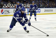 Tampa Bay Lightning right wing Nikita Kucherov (86) moves the puck against the New York Islanders during the second period in Game 7 of an NHL hockey Stanley Cup semifinal playoff series Friday, June 25, 2021, in Tampa, Fla. (AP Photo/Chris O'Meara)