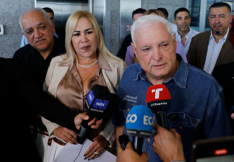 Panama's former President Ricardo Martinelli addresses the media while leaving the National Assembly, in Panama City