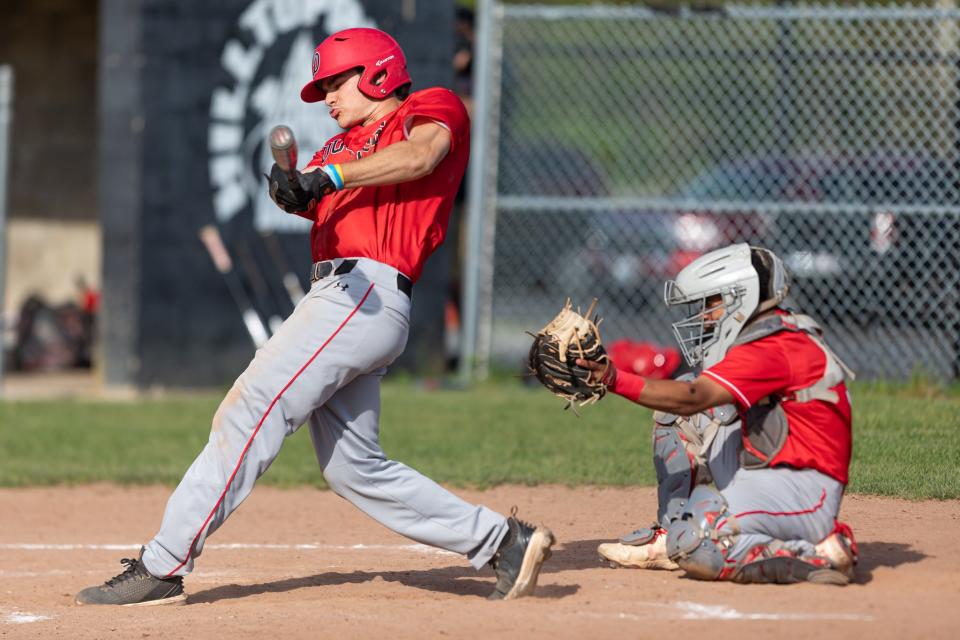 Durfee’s Ryan Lopes swings through a pitch for a double on Monday against New Bedford. 