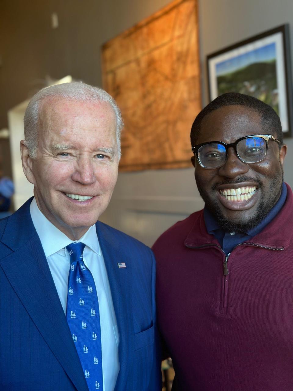 President Joe Biden with Ike Ekeke of Finneytown at at Just Q'in BBQ restaurant in the Walnut Hills neighborhood of Cincinnati after speaking on a $1.6 billion federal investment in the long-awaited upgrade of the Brent Spence Bridge in Covington on Wednesday.