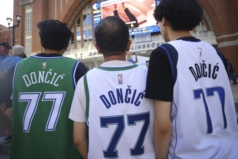 Fans wearing the jersey number of Dallas Mavericks guard Luka Doncic arrive for Game 4 of the Western Conference finals in the NBA basketball playoffs between the Mavericks and the Minnesota Timberwolves, Tuesday, May 28, 2024, in Dallas. (AP Photo/Gareth Patterson)