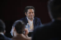 Venezuelan conductor Gustavo Dudamel delivers a press conference at the Palais Garnier opera house, in Paris Friday, April 16, 2021. The Paris Opera announced the arrival of Gustavo Dudamel as music director for six seasons. (AP Photo/Christophe Ena)