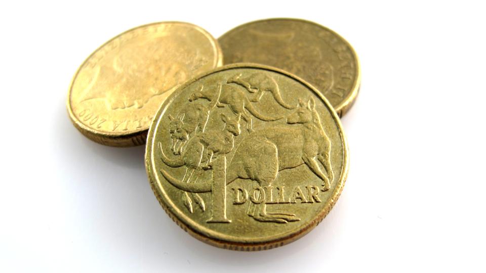 Three Australian one dollar coins.                               