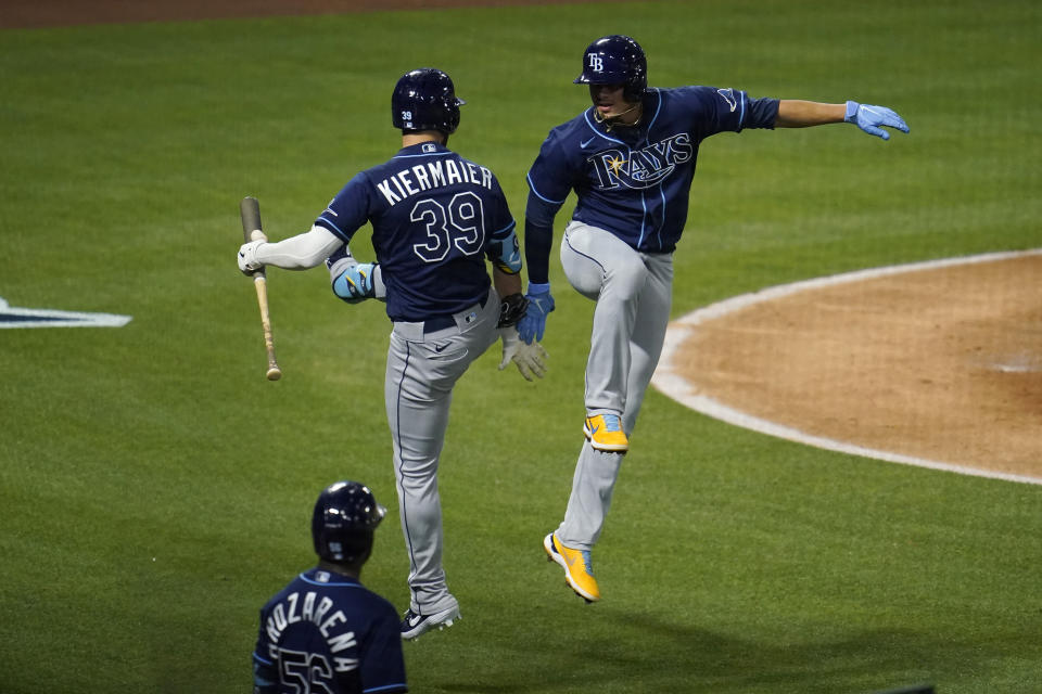 Tampa Bay Rays' Willy Adames, right, celebrates his solo home run with Kevin Kiermaier (39) during the fourth inning of a baseball game against the Los Angeles Angels Monday, May 3, 2021, in Anaheim, Calif. (AP Photo/Marcio Jose Sanchez)