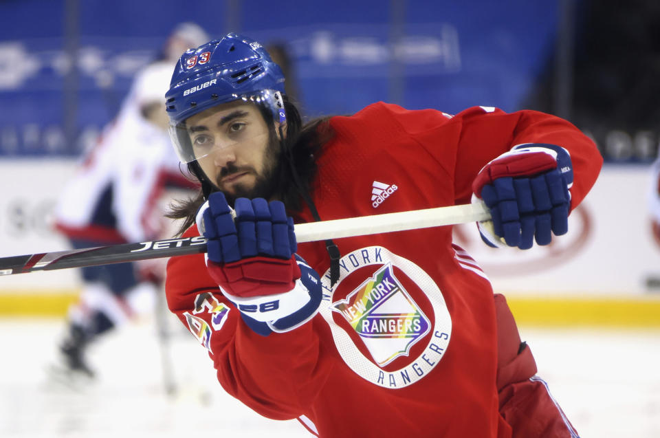 FILE - New York Rangers' Mika Zibanejad wears a Pride-themed jersey in warmups prior to an NHL hockey game against the Washington Capitals Monday, May 3, 2021, in New York. At least one National Hockey League team with a Russian player on its roster has decided against wearing special warmup jerseys to commemorate Pride Night because of a Russian law that expands restrictions on activities seen as promoting LGBTQ rights. (Bruce Bennett/Pool Photo via AP, File)