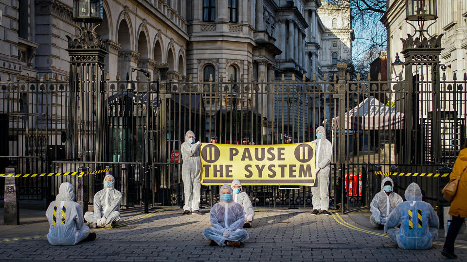 Protestors wearing hamzat suits congregated outside Downing Street on Monday to demand action on coronavirus.