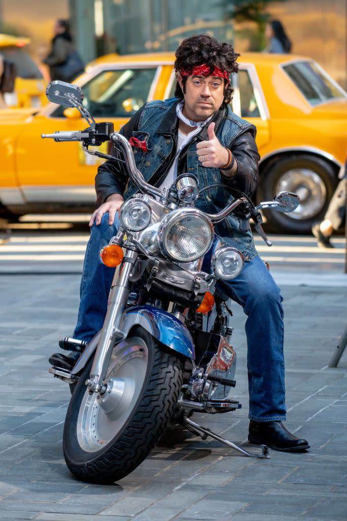 <p>Carson Daly flashes a thumbs up as he arrives in style to tape the 2018 Halloween episode of <em>Today</em> dressed like The Boss. Forget "Born to Run" — in this look, the host looks born to <em>ride</em>. </p>