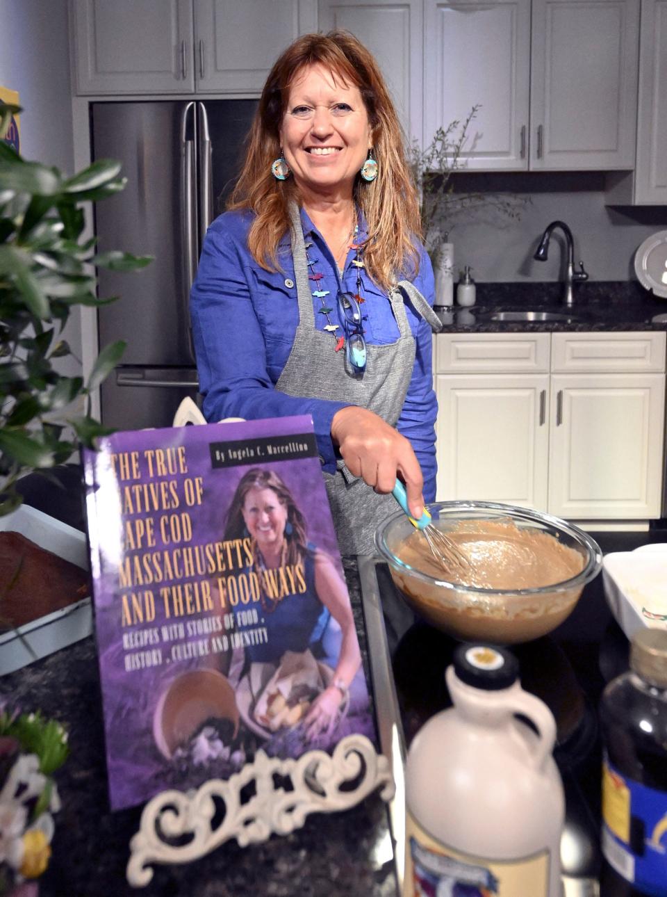 Mashpee Wampanoag Tribe member and author Angela Marcellino prepares an Indian pudding as part of her cooking demonstration on Tuesday at Falmouth Community Television.