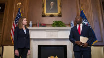 Judge Amy Coney Barrett, President Donald Trumps nominee for the U.S. Supreme Court, meets with Sen. Tim Scott, R-S.C., on Capitol Hill in Washington, Wednesday, Sept. 30, 2020. (Shawn Thew/Pool via AP)