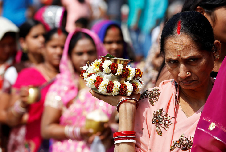 <p>Hindu devotees queue outside a temple with their offerings during the Maha Shivaratri festival in Kolkata, India, Feb. 24, 2017. REUTERS/Rupak De Chowdhuri </p>