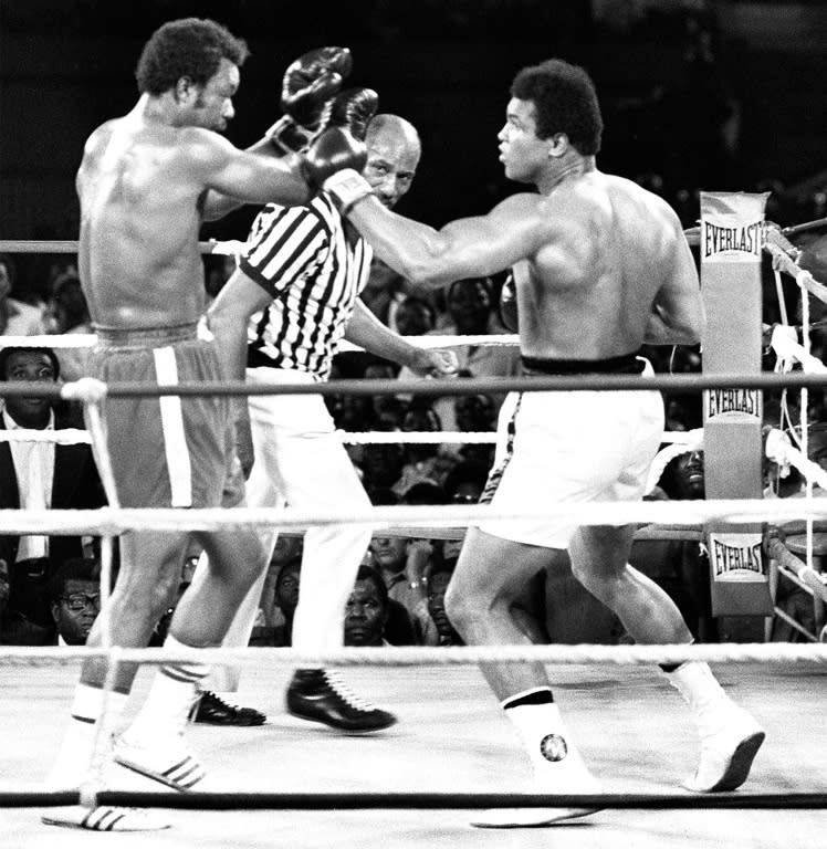 The famous 1974 Rumble in the Jungle between Muhammad Ali (R) and his compatriot and the titleholder George Foreman in Kinshasa. Ali won back his title as world heavyweight boxing champion