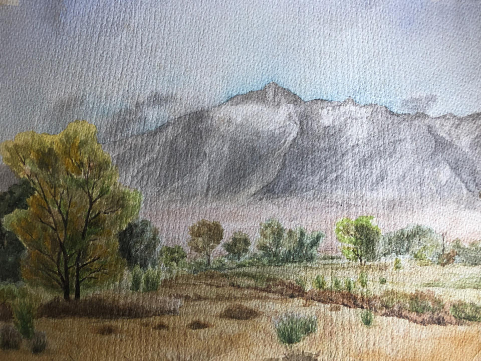 This image provided by Lisa Reilly, a granddaughter of Giichi Matsumura, on Friday, Feb. 5, 2011, shows a watercolor painting of California's Mount Williamson by Matsumura. Giichi Matsumura, who died in the Sierra Nevada on a fishing trip while he was at the Japanese internment camp at Manzanar, was reburied in the same plot with his wife 75 years later after his remains were unearthed from a mountainside grave. (Lisa Reilly via AP)
