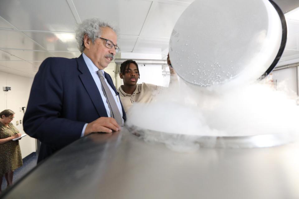 Dr. Mitchell Cairo and Hanif Mouehla, 17, look at a freezer for stem cell samples at Maria Fareri Children's Hospital in Valhalla July 17, 2023. Mouehla participated in a cell transplantation trial there to treat his sickle cell anemia.