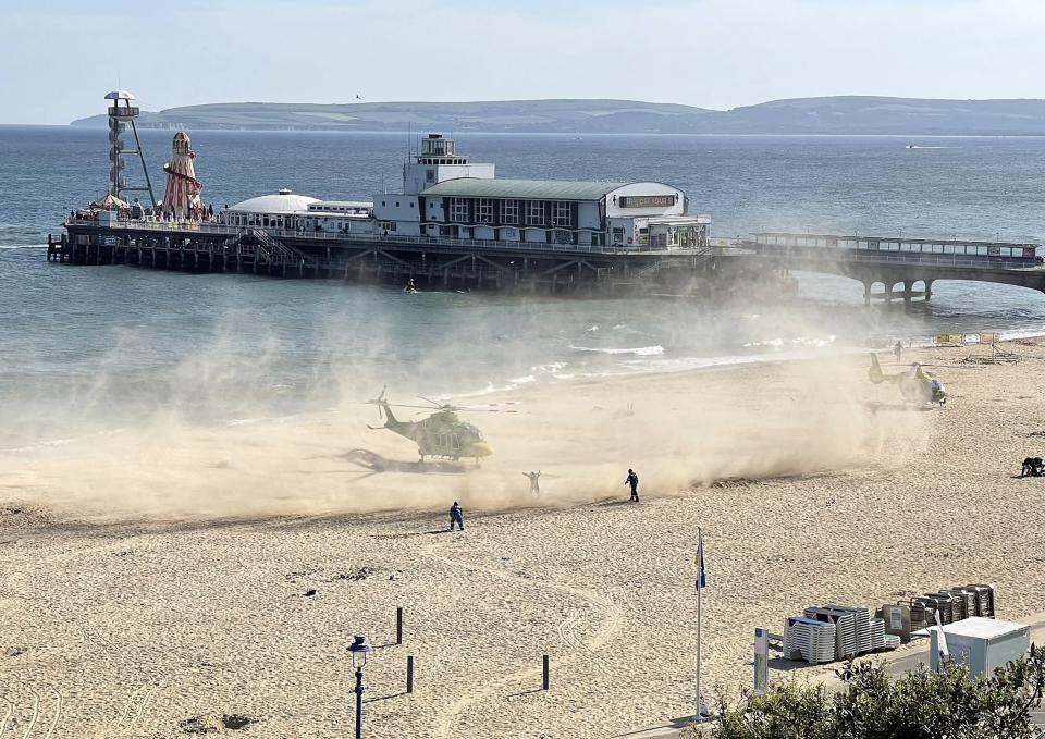 A helicopter lands at the beach during the incident at Bournemouth beach on Wednesday. (PA/Twitter/Professor Dimitrios Buhalis)