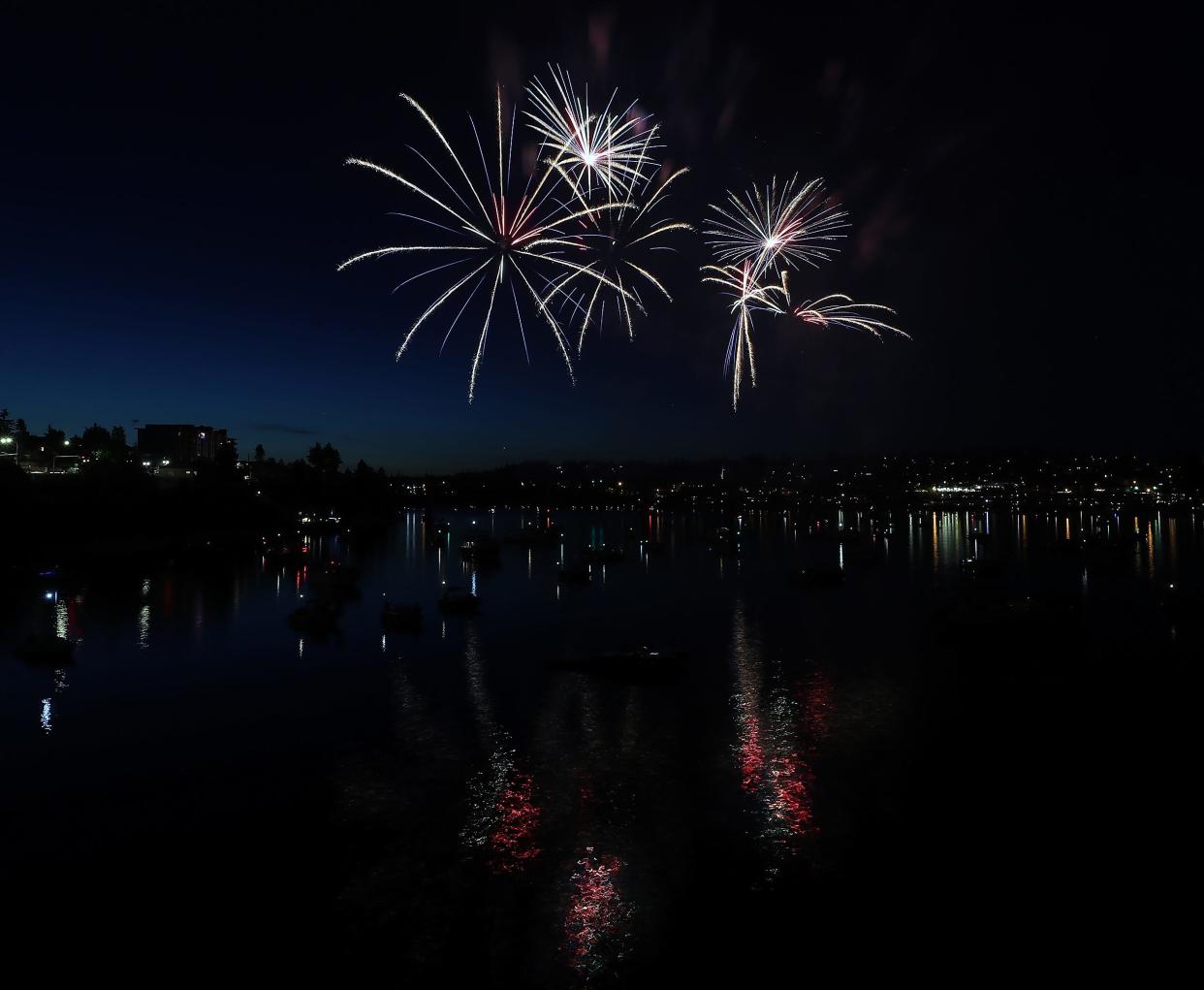 FILE — Fireworks light up the sky during the Bremerton Bridge Blast in June 2019. A series of explosions on Saturday surprised many residents of Bainbridge, who called 911 not recognizing the sounds as fireworks. The Coast Guard said a permit was filed for the show over the waters of Puget Sound by Oregon-bases Western Display Fireworks.