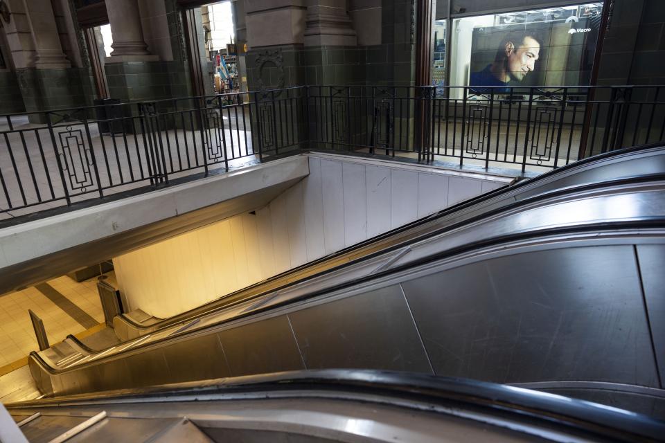 Ad ad featuring Argentine soccer team coach Lionel Scaloni covers a wall at the Retiro train station that is empty due to a general strike against the reforms of President Javier Milei in Buenos Aires, Argentina, Thursday, May 9, 2024. (AP Photo/Rodrigo Abd)