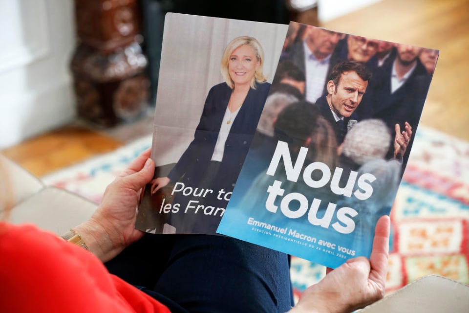 Official campaign posters of Marine Le Pen, leader of the far-right Rassemblement national (RN) party and French President Emmanuel Macron 'La République en marche' (LREM), candidates in the 2022 French presidential election on April 23, 2022 in Paris, France.<span class="copyright">Photo illustration by Chesnot/Getty Images</span>