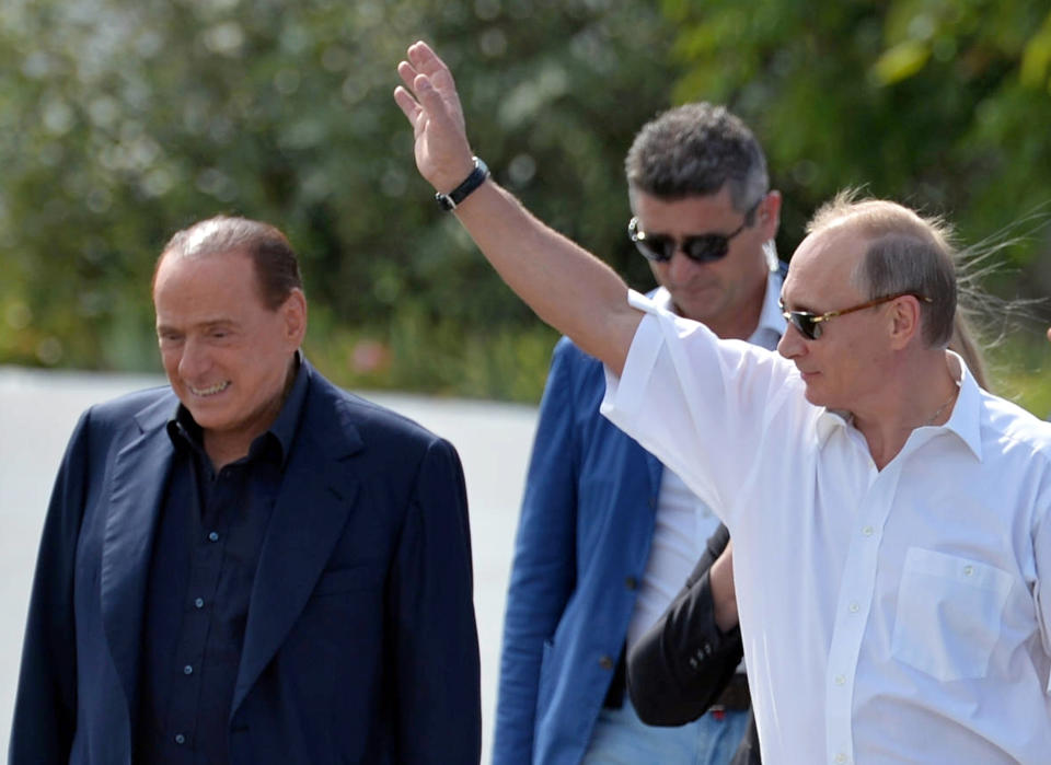 FILE - Russian President Vladimir Putin, right, and former Italian Prime Minister Silvio Berlusconi visit the Khan's Palace in the town of Bakhchisarai, Crimea, on Sept. 12, 2015. Berlusconi, the boastful billionaire media mogul who was Italy's longest-serving premier despite scandals over his sex-fueled parties and allegations of corruption, died, according to Italian media. He was 86. (Alexei Druzhinin/RIA-Novosti, Kremlin Pool Photo via AP)