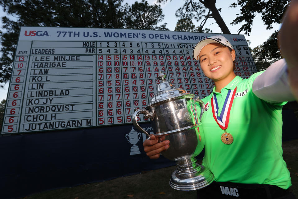 Pictured here, Australia's Minjee Lee posing in front of the scoreboard after winning the 77th US Women's Open.