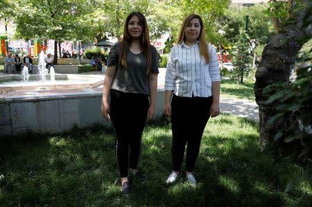 Twin sisters Sinem (L) and Simge Tuncbilek pose for a picture during an interview with Reuters in Ankara, June 9, 2018. REUTERS/Umit Bektas