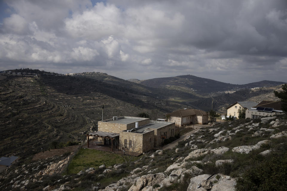 Houses sit on a hill at the West Bank settlement outpost of Givat Harel, Thursday, Feb. 16, 2023. Israel's new ultranationalist government declared last week that it would legalize 10 unauthorized outposts in the occupied West Bank. The rare move intensified the country's defiance of international pressure and opened an aggressive new front of Israeli expansion into the West Bank, which Israel captured in the 1967 Mideast war. (AP Photo/ Maya Alleruzzo)