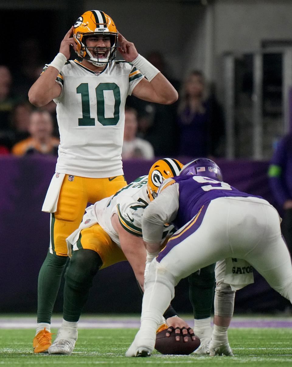 Green Bay Packers quarterback Jordan Love makes an adjustment at the line during the fourth quarter of the team's 33-10 win over the Minnesota Vikings on Dec. 31, 2023, at U.S. Bank Stadium.