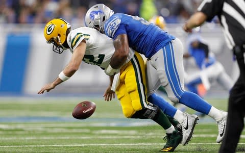 Detroit Lions defensive end Da'Shawn Hand (93) makes Green Bay Packers quarterback Aaron Rodgers (12) to fumble the ball during the second quarter at Ford Field. - Credit: (Raj Mehta/USA Today)