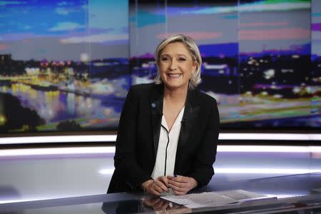 Marine Le Pen, French National Front (FN) political party leader and candidate for French 2017 presidential election, poses prior to an interview on the prime time evening news broadcast of French TV channel TF1, in Boulogne-Billancourt, near Paris, France, February 22, 2017. REUTERS/Patrick Kovarik/Pool