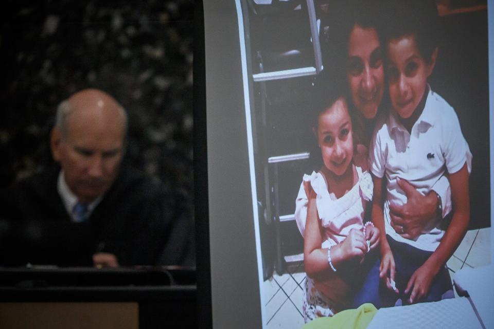 A photo of Veronica Raschiotto with her two children Mia Martinez Raschiotto and Diego Martinez Raschiotto is shown in Judge Jeffrey Gillen's courtroom during openings statements at Paul Streater's vehicular homicide and DUI manslaughter trial at the Palm Beach County Courthouse in West Palm Beach, Fla., on October 17, 2022. The Raschiotto family was killed in a vehicle crash with Paul Streater in April 2018.