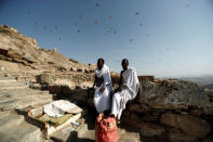 Muslim pilgrims from Somalia rest while they climb the Mount Al-Noor, where Muslims believe Prophet Mohammad received the first words of the Koran through Gabriel in the Hera cave, ahead of annual Haj pilgrimage in the holy city of Mecca, Saudi Arabia August 18, 2018. REUTERS/Zohra Bensemra