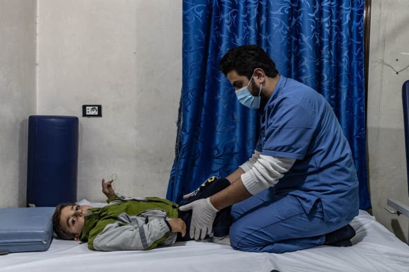 A child is given physical therapy at Aqrabat Specialized Hospital in Idlib Governorate after being injured in the 7.8-magnitude earthquake that struck southern Turkey and northern Syria on February 6, 2023. Anas Alkharboutli/dpa
