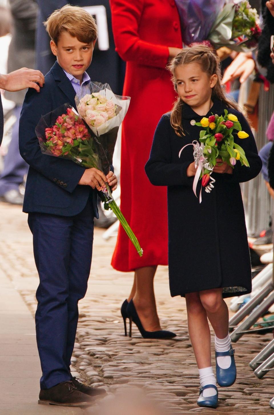 The Duke and Duchess of Cambridge, Prince George and Princess Charlotte speak to wellwishers during their visit to Cardiff Castle