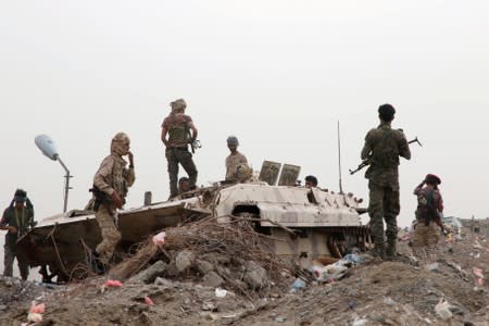 FILE PHOTO: Members of UAE-backed southern Yemeni separatist forces stand by a military vehicle during clashes with government forces in Aden