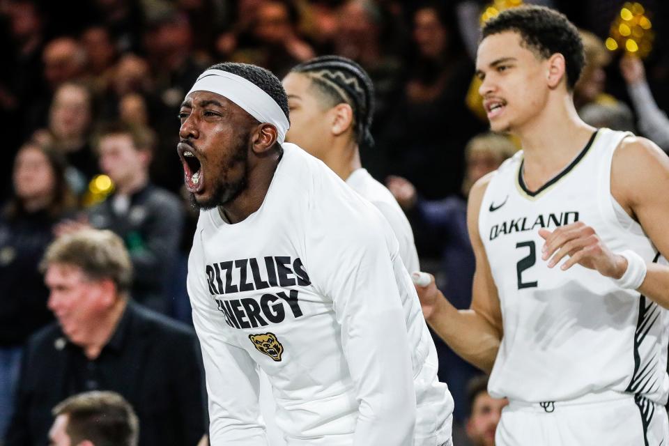 Oakland guard DQ Cole (10) celebrates a play against Purdue Fort Wayne from the bench during the second half of Horizon League tournament quarterfinal at O'Rena in Rochester on Thursday, March 7, 2024.