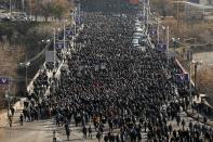 FILE In this file photo taken on Saturday, Dec. 19, 2020, Armenians attend a march of remembrance of the heroes killed during the during the fighting over Nagorno-Karabakh in 2020 year, in Yerevan, Armenia. Armenians head to the polls Sunday for a snap parliamentary election stemming from a political crisis that has engulfed the former Soviet nation ever since last year's fighting over the separatist region of Nagorno-Karabakh. (Tigran Mehrabyan/PAN Photo via AP, File)