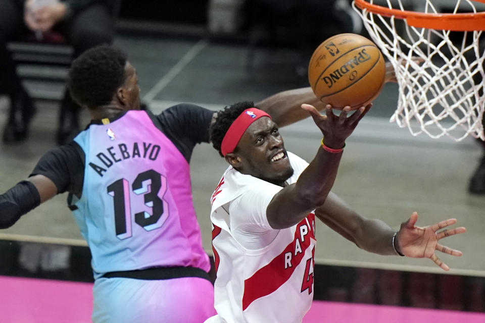 Toronto Raptors forward Pascal Siakam, right, shoots over Miami Heat center Bam Adebayo (13) during the first half of an NBA basketball game, Wednesday, Feb. 24, 2021, in Miami. (AP Photo/Lynne Sladky)