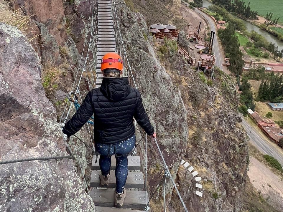 Victoria crossing the suspension bridge on the mountain.